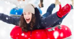 Girl snow tubing 