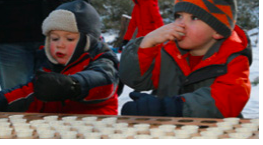 Children drinking maple syrup