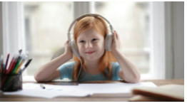 Little girl with headphones on