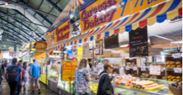 People at a market stand