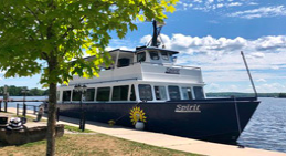 Cruise ship docked by sidewalk