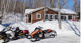 Snowmobiles parked in the snow