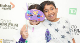 Kids wearing a party mask