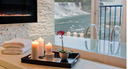 Candles overlooking a view of waterfall