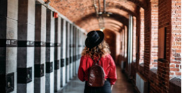 Girl walking through a corridor in a jail