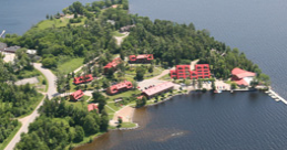 Birds eye photo of lakefront with buildings 