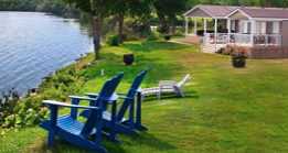 Muskoka chairs overlooking a lake