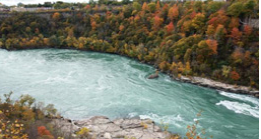 Rapids along a fall forest