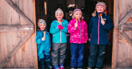 A group of kids eating maple taffy