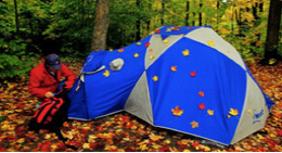 Tent in the woods in fall