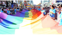 People holding a rainbow flag