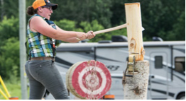 Women hitting a piece of wood with an axe