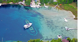 Birds eye view of water, boats and land