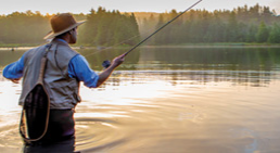 A man fishing on a lake