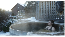 Women sitting in an outdoor hot tub