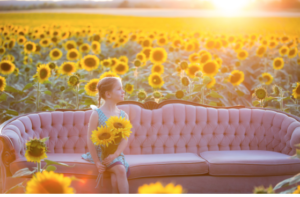 A little girl in a field of sunflowers