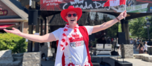 A man waving a Canadian flag