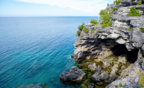 Blue water and a cliff