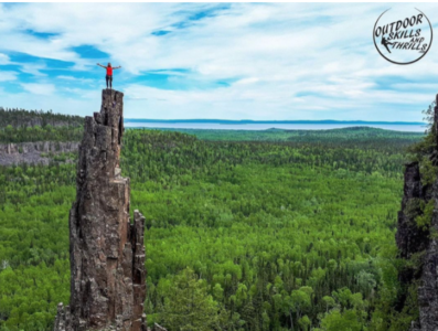 A person standing on the top of a mountain 