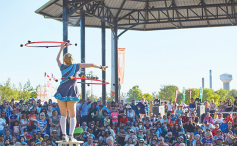 An acrobat performing in front of a crowd