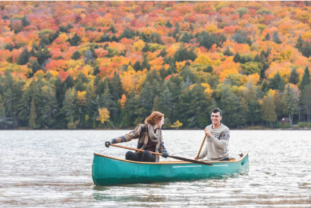 A man and women in a canoe 