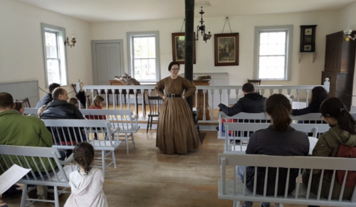 A women standing in front of a classroom 