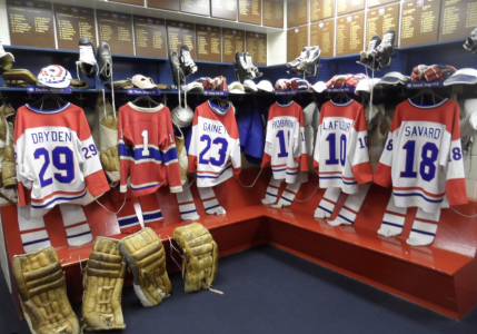 A locker room with hockey equipment 